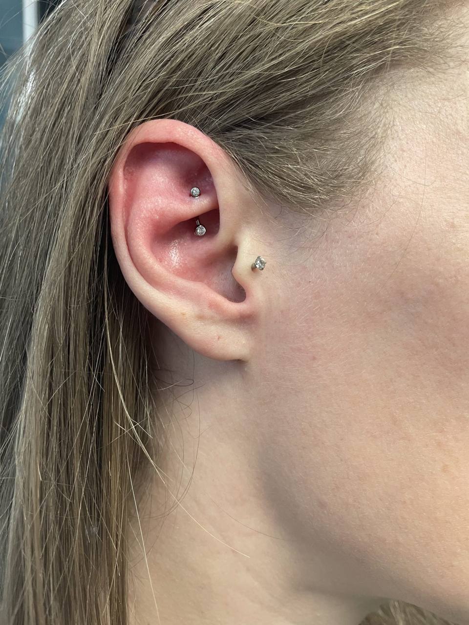 Curated ear piercing by Bella Mertz at Grade A Tattoos in Fort Wayne