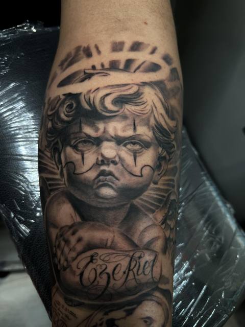 Black and gray cherub portrait tattoo by Allen Bracknell, Fort Wayne tattoo artist